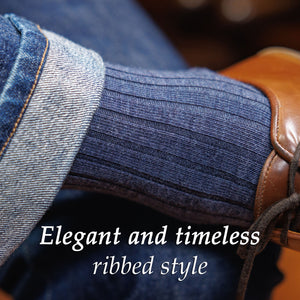 man wearing denim wool dress socks and jeans crossing legs