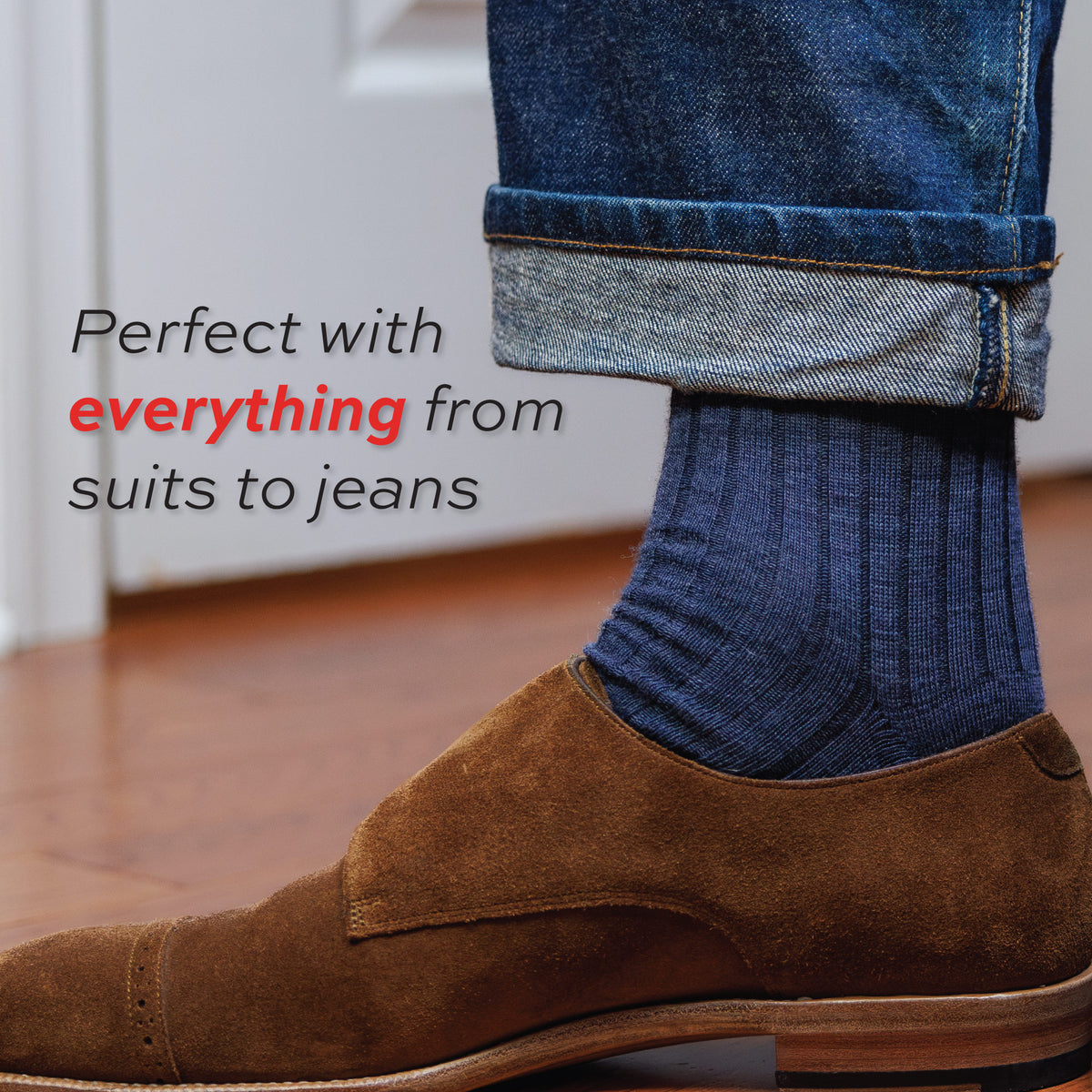 man wearing jeans and denim merino wool over the calf length dress socks with "perfect with everything from suits to jeans" text overlay