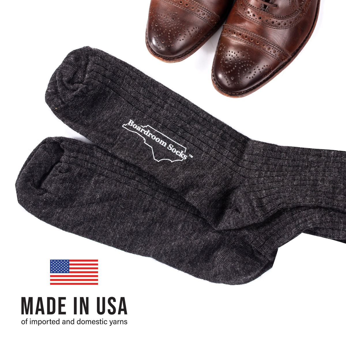 flat lay image of oxfords and charcoal wool merino socks with "made in USA" text overlay