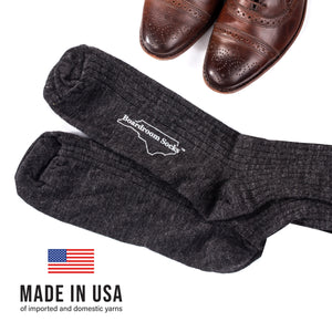 flat lay image of oxfords and charcoal wool merino socks with 