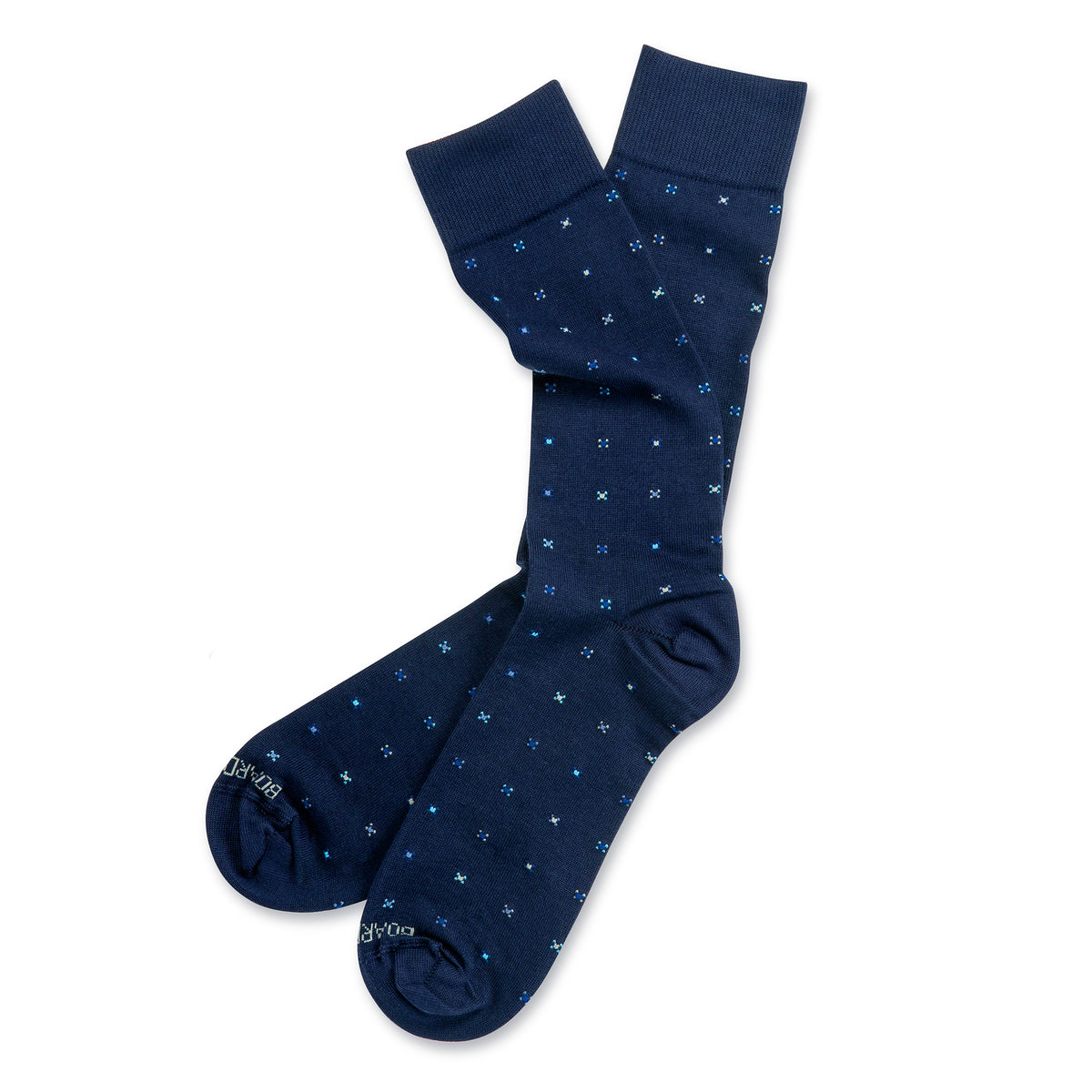 flat lay image of navy mid calf cotton dress socks with geometric pattern on a white background