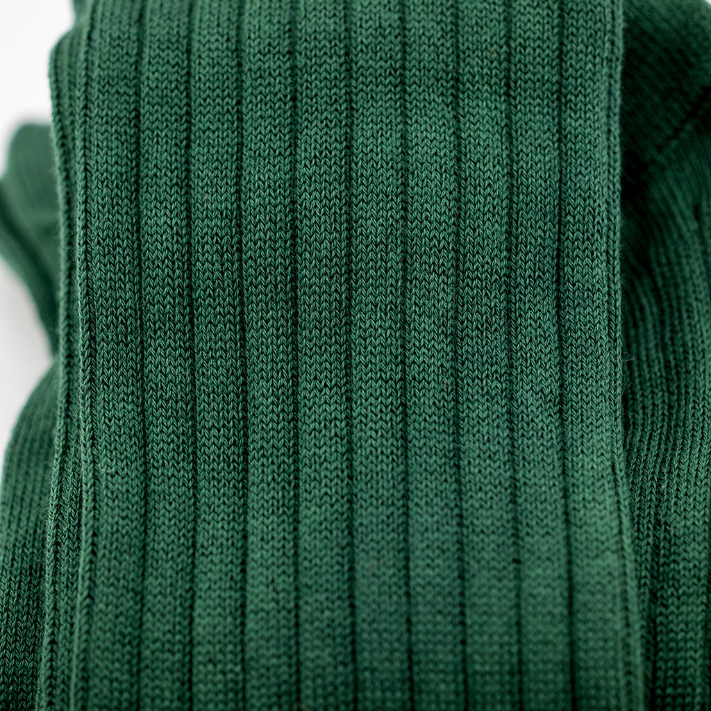 close up of forest green ribbed dress socks