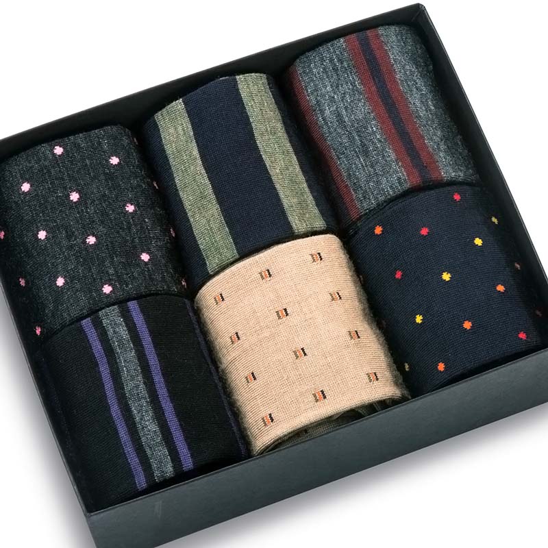 opened gift box displaying six pairs of colorful, patterned dress socks from Boardroom Socks