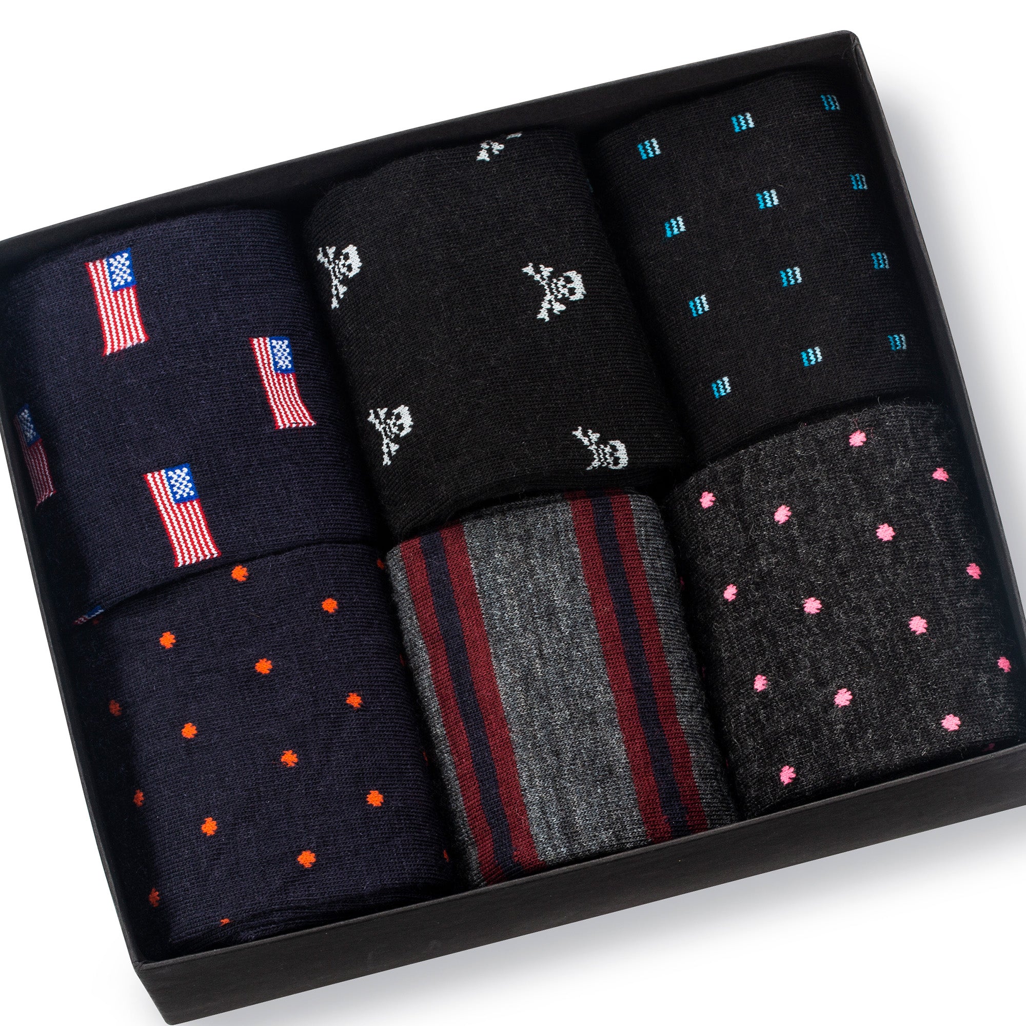 six pairs of wool patterned dress socks arranged in a black gift box