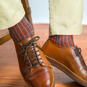 grey and orange shadow stripe dress socks worn with khaki chinos and brown leather sneakers
