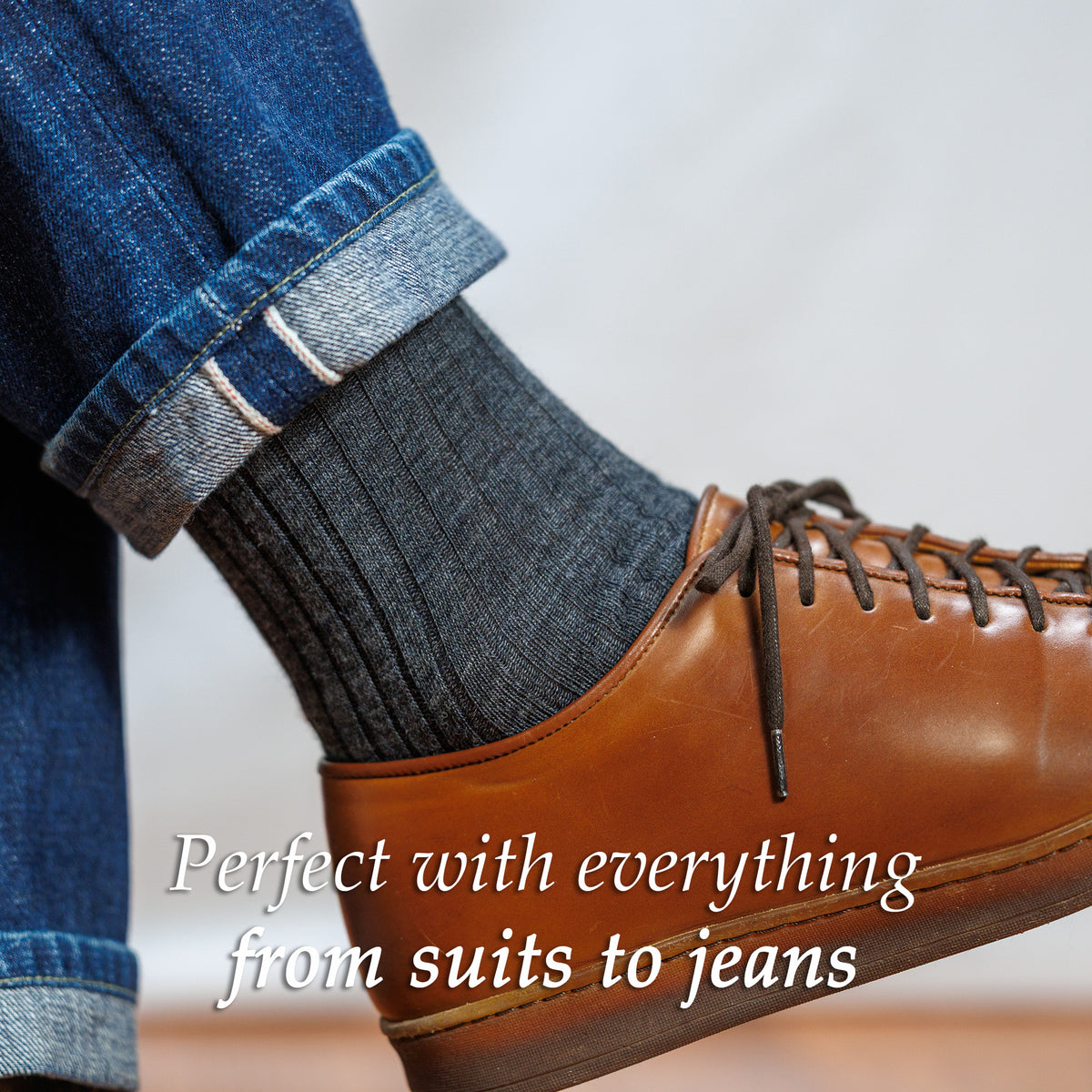 man wearing grey heather wool dress socks with jeans and sneakers