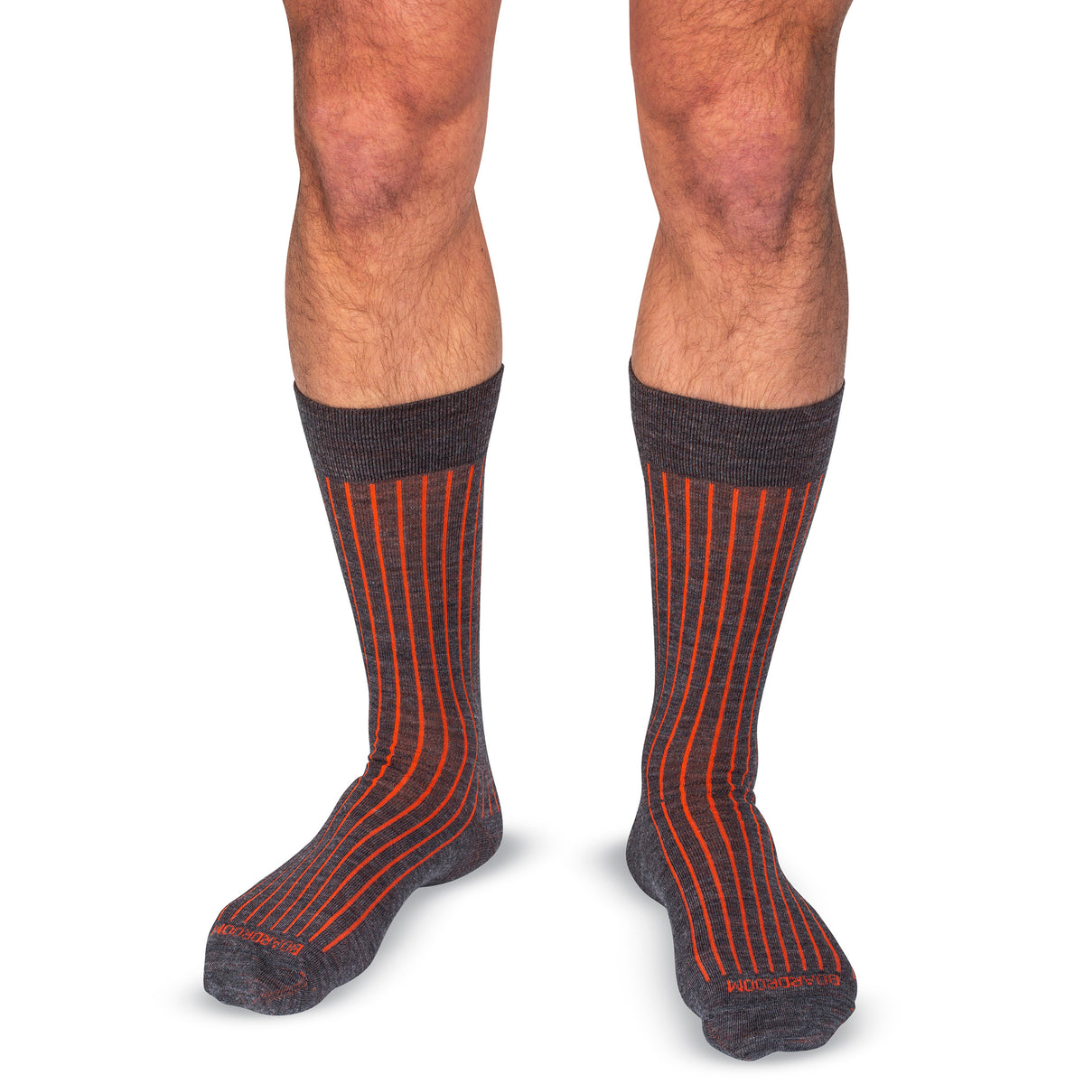 model wearing grey and orange mid-calf length shadow stripe dress socks