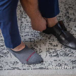 man wearing grey no show dress socks with navy slacks and black dress shoes