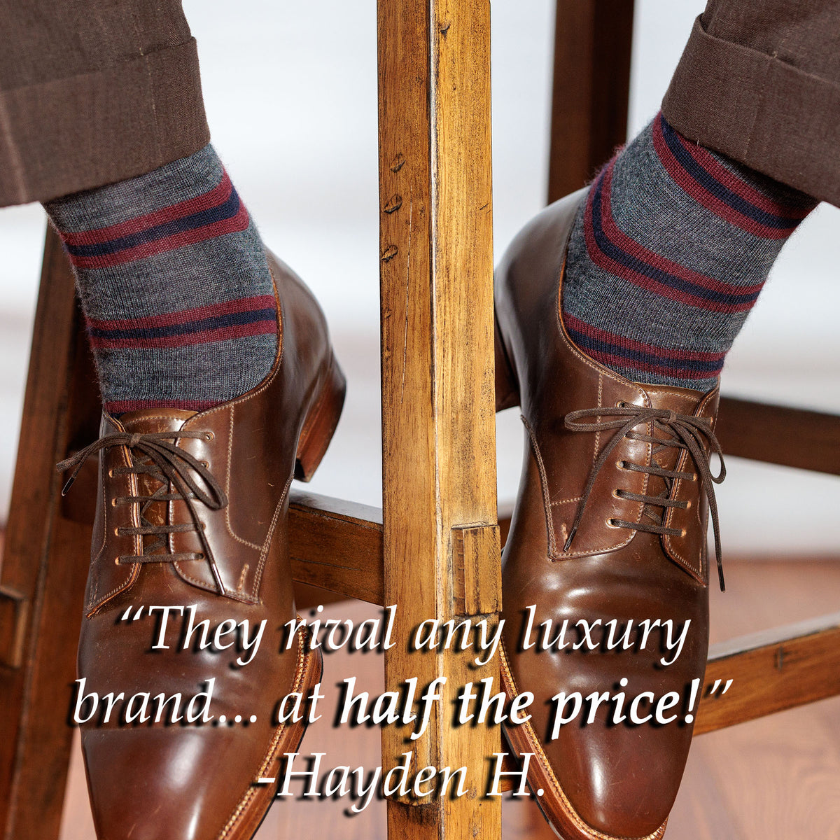 man wearing grey heather striped dress socks sitting on stool