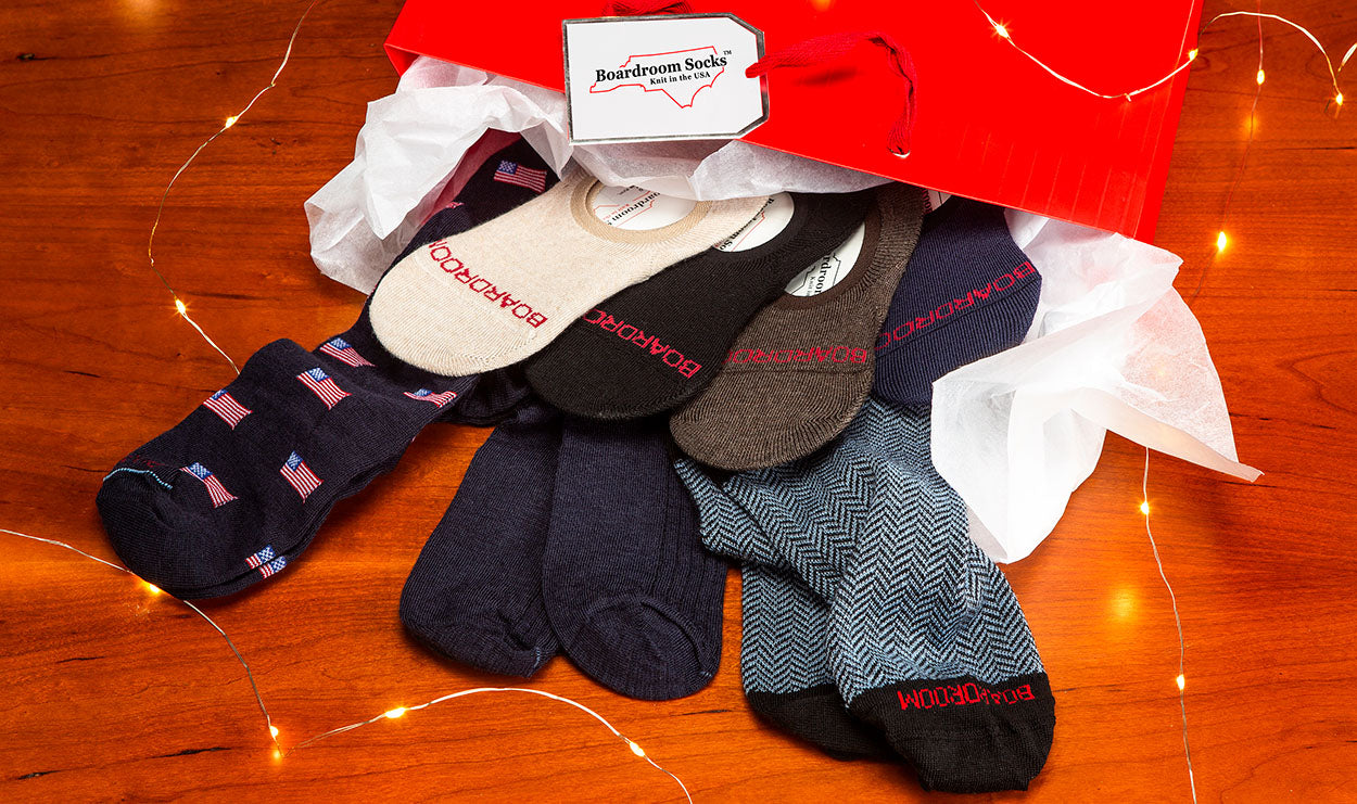 holiday gift bag filled with merino wool dress socks from Boardroom Socks