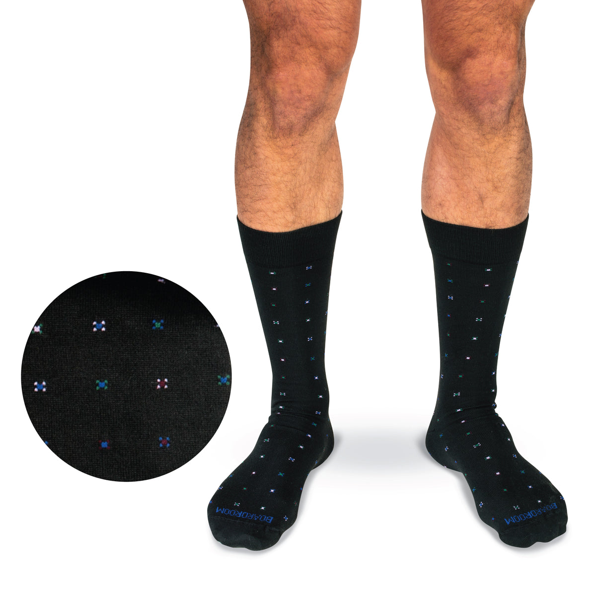legs of a model on a white background wearing mid calf geometric cotton dress socks