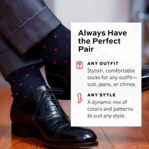 infographic detailing sock style superimposed over photo of man crossing legs wearing navy socks with black oxfords and grey suit