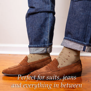 man wearing jeans with khaki cotton dress socks and brown suede penny loafers