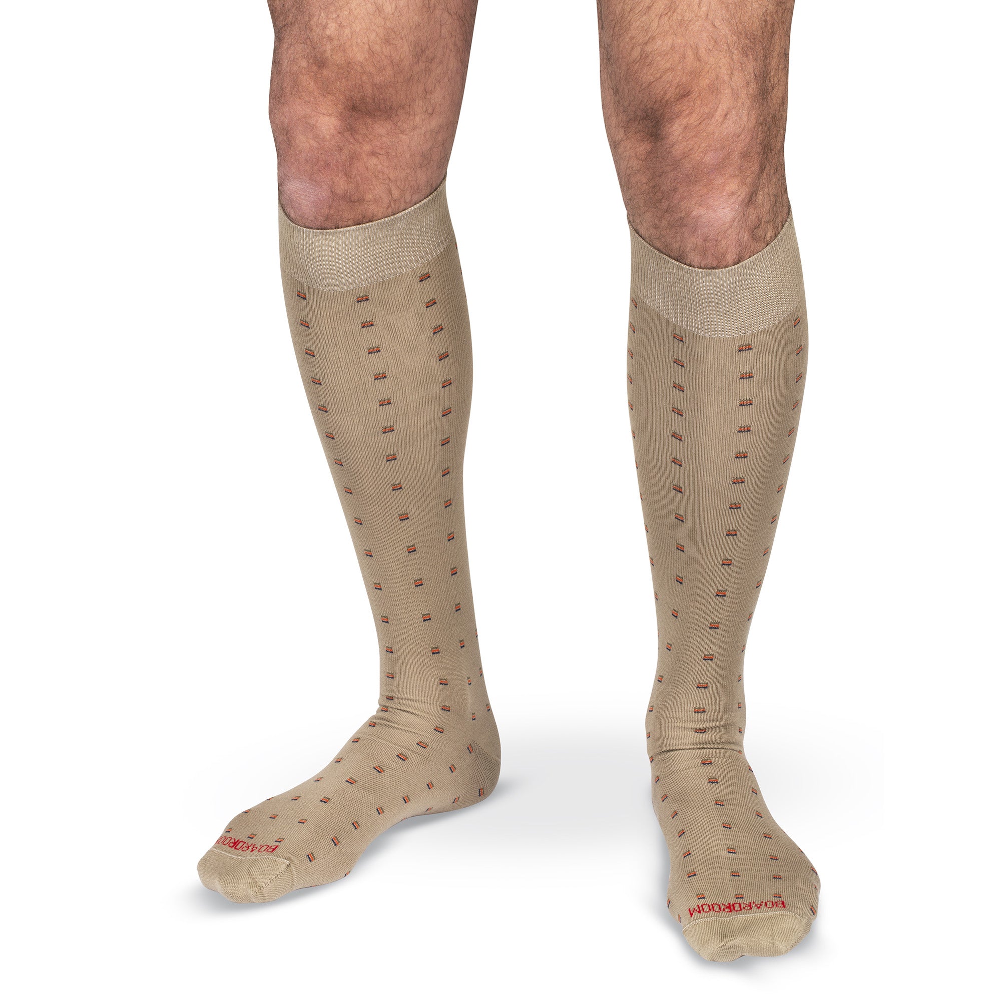 model wearing patterned khaki over the calf dress socks