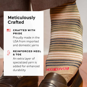 tan striped dress socks with text about craftsmanship and durability, worn with brown slacks and penny loafers