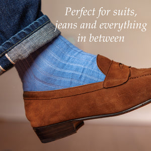 baby blue dress socks paired with jeans and light brown suede loafers