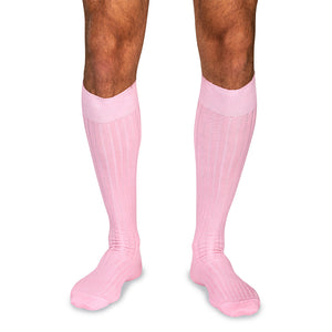 model wearing pink wool over the calf dress socks