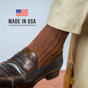 person wearing khakis and Light Brown Merino Wool Over the Calf Dress Socks with made in usa text overlay