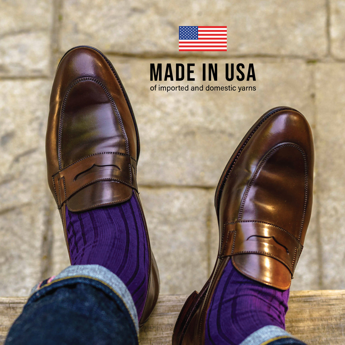 man sitting down wearing loafers, jeans and Purple Cotton Mid Calf Dress Socks