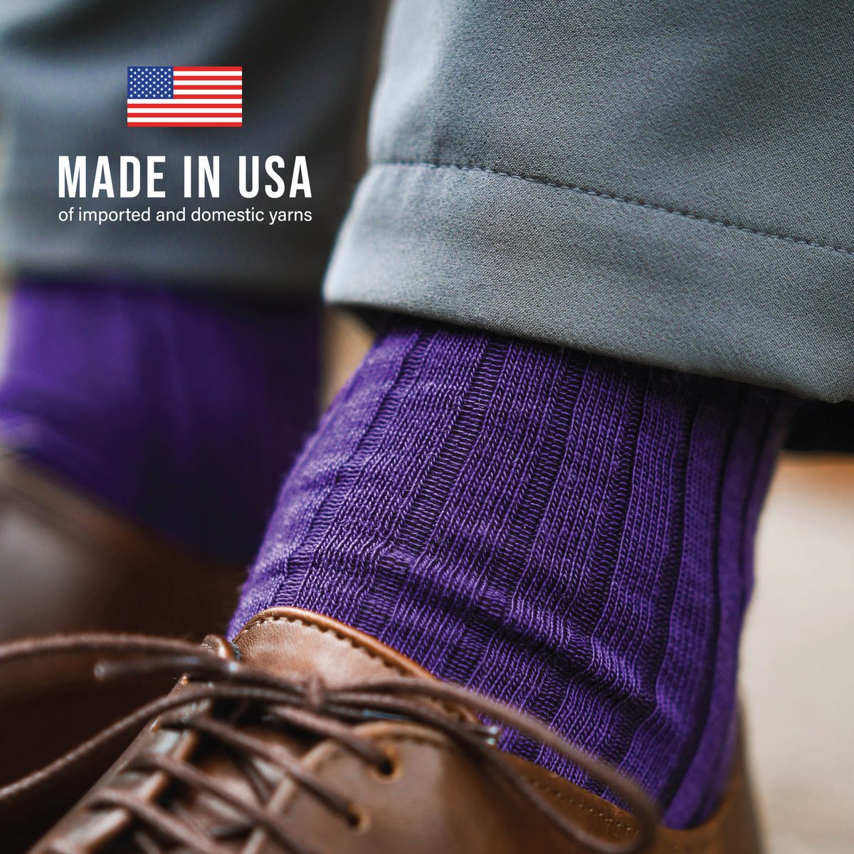 very close up shot of the ribbed detail of purple merino wool socks with made in usa text overlay