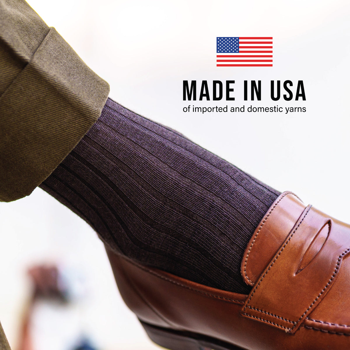 close up of over the calf brown merino wool ribbed dress socks with made in usa text overlay