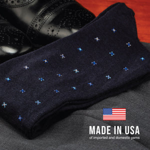 flay laying pair of Navy Geometric Merino Wool Over the Calf Dress Socks on clothing
