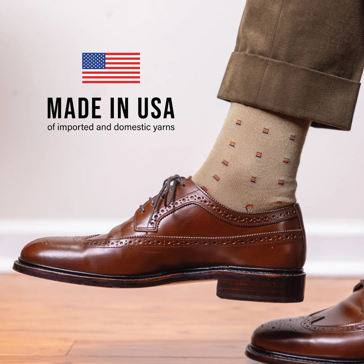 man wearing noice brown shoes, khakis and khaki patterned dress socks with made in usa text overlay