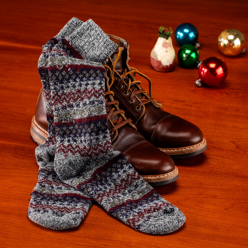 grey merino wool Fair Isle socks with dress boots and holiday decor