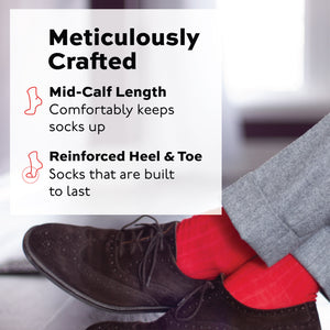 person crossing their legs wearing nice shoes and red merino wool mid calf socks