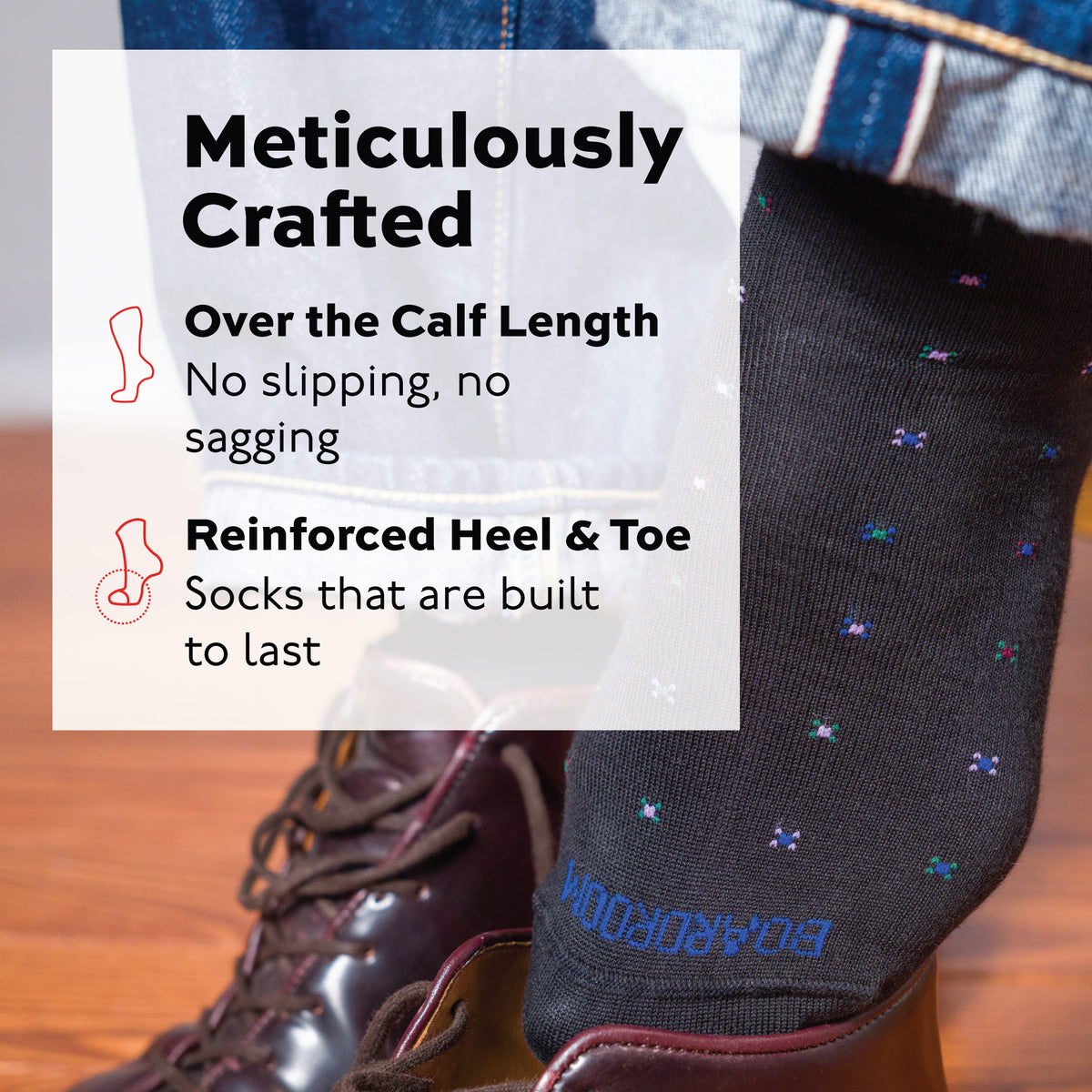 man putting on his shoe wearing a black geometric pattern cotton over the calf dress socks