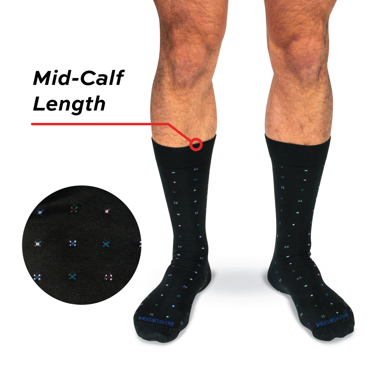 model wearing mid-calf length black cotton dress socks with geometric pattern on a white background