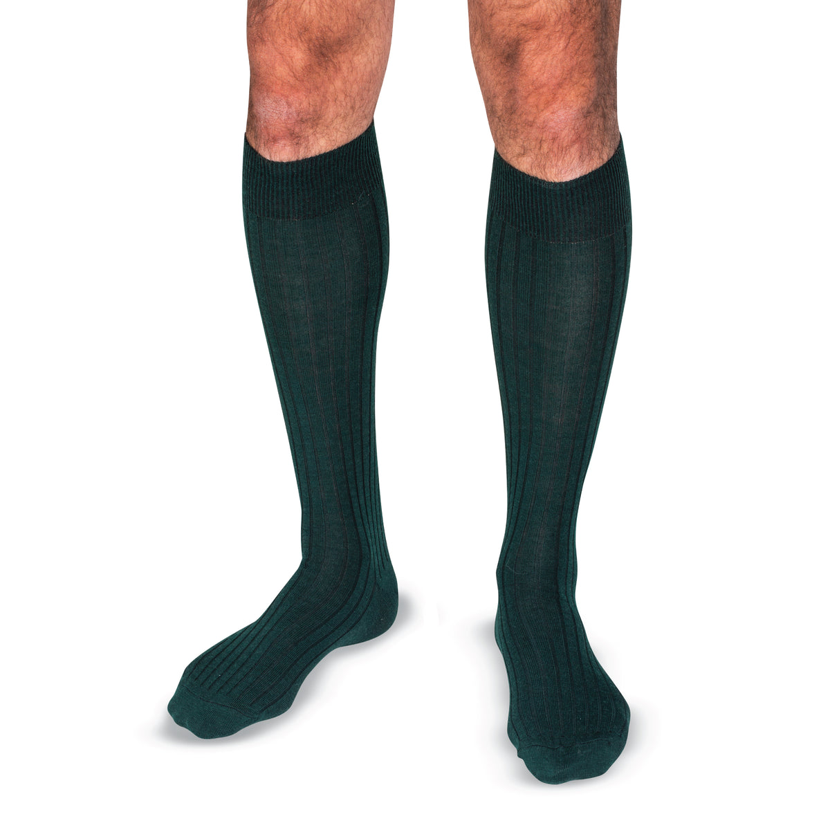 model wearing Forest Green Merino Wool Over the Calf Dress Socks on a white background