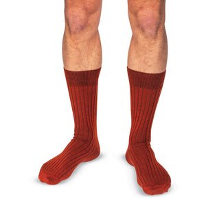 model wearing Burnt Orange Merino Wool Mid Calf Dress Socks on a white background