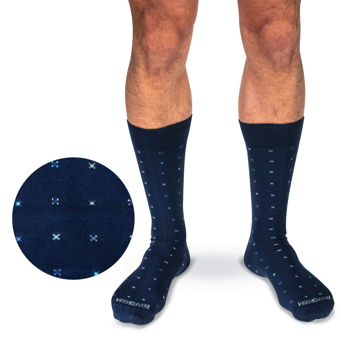 model wearing mid calf navy geometric pattern cotton dress socks on a white background