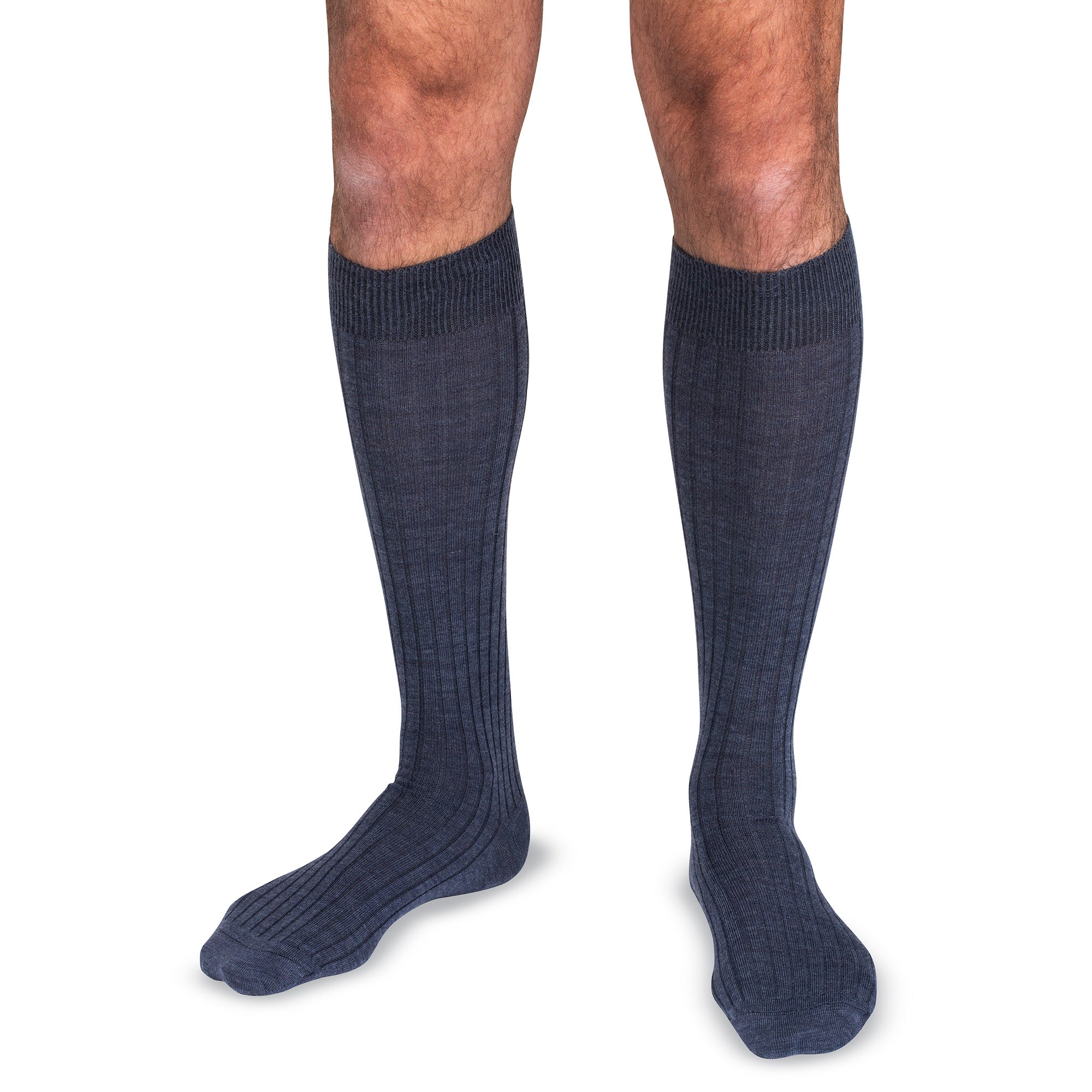 model wearing heather blue over the calf wool dress socks