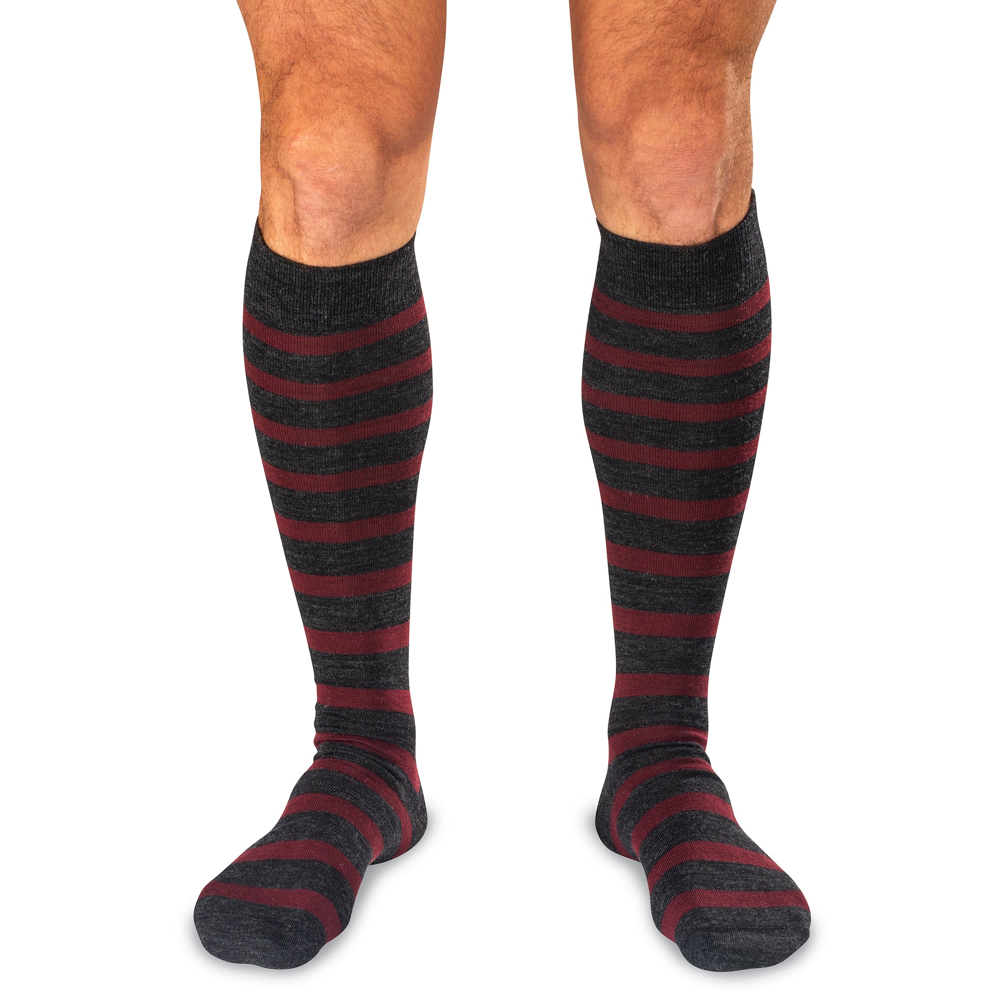 model wearing charcoal and burgundy striped over the calf dress socks