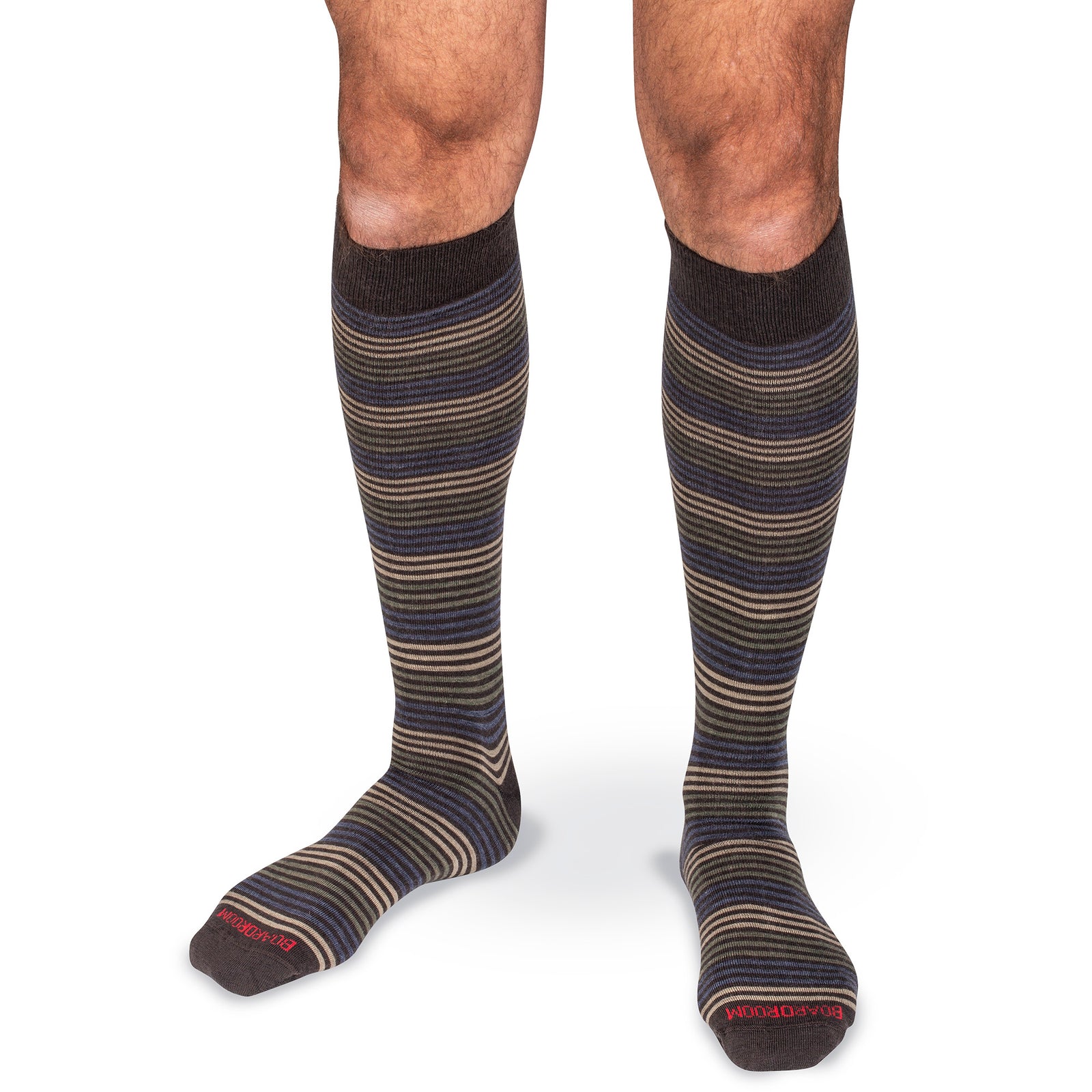 model wearing brown knee high striped dress socks on white background