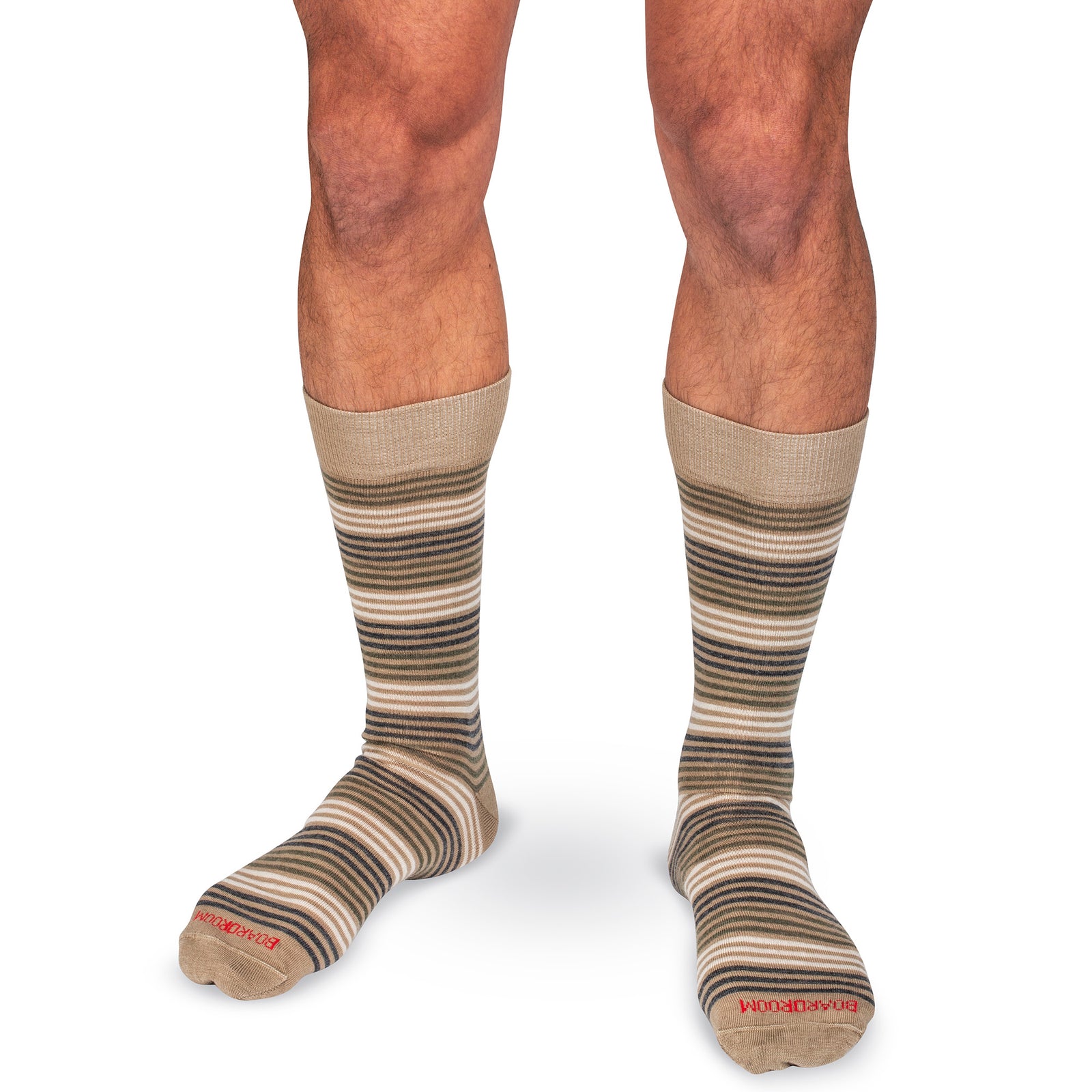 beige striped dress socks worn by a model in front of a white background