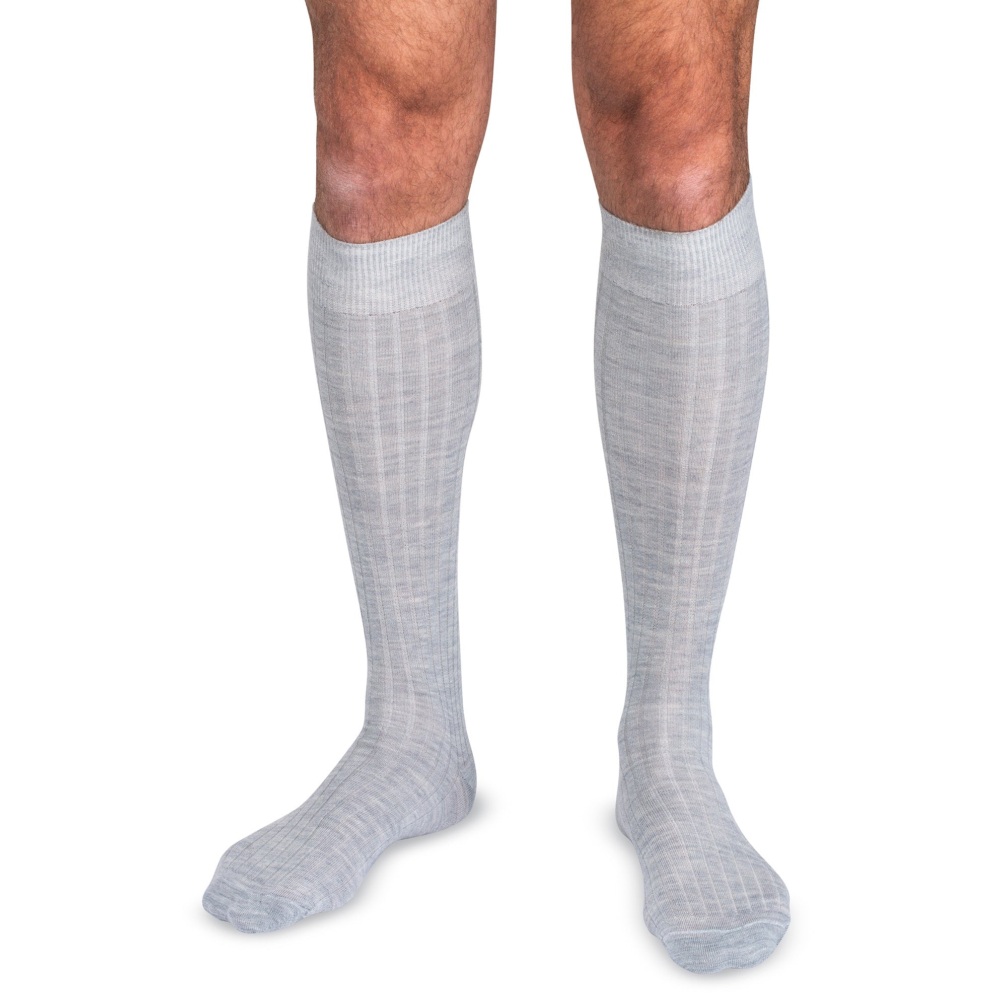 model wearing light grey merino wool over the calf dress socks