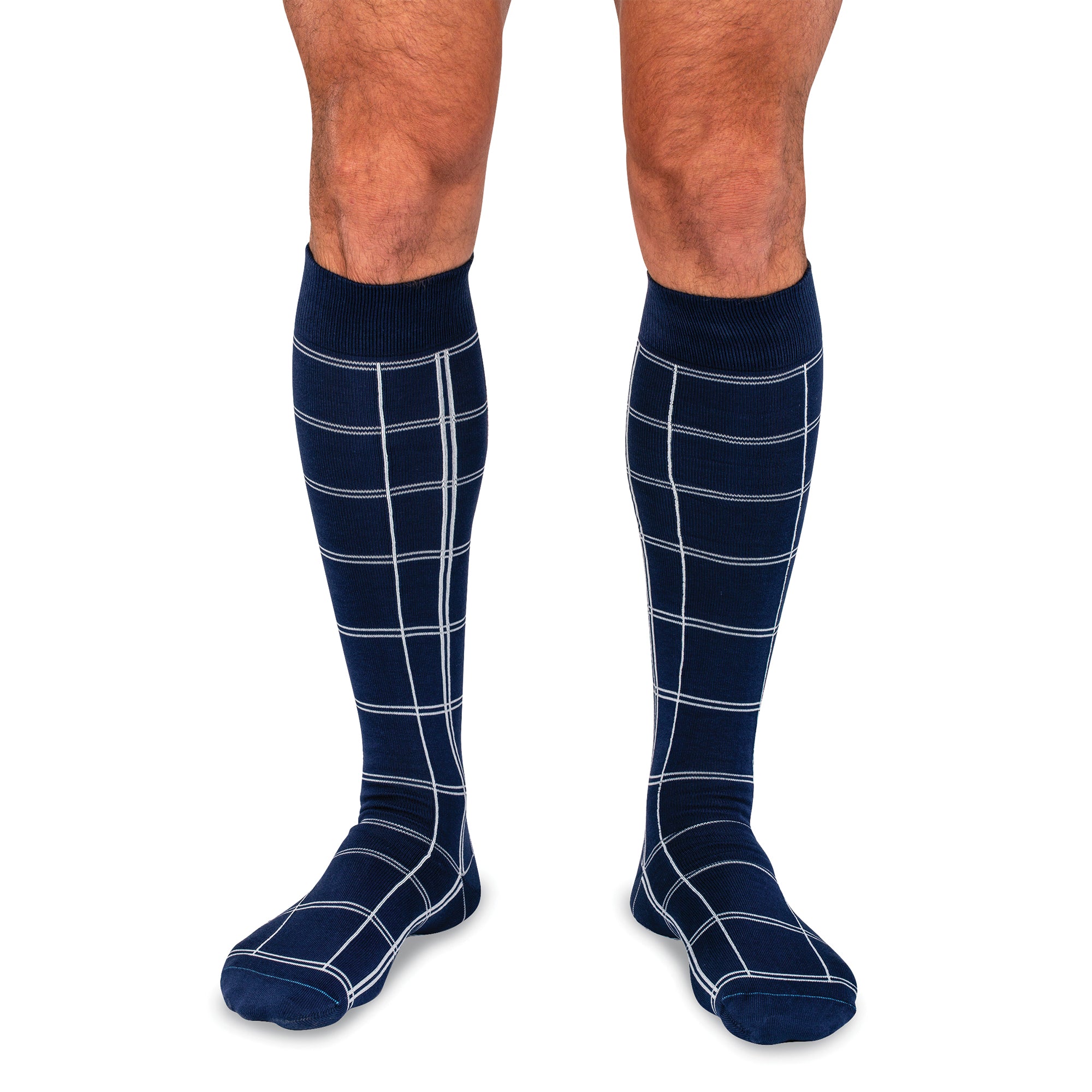 model wearing navy over the calf dress socks with a windowpane motif