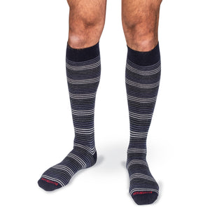 knee-high striped dress socks worn by a model on a white background