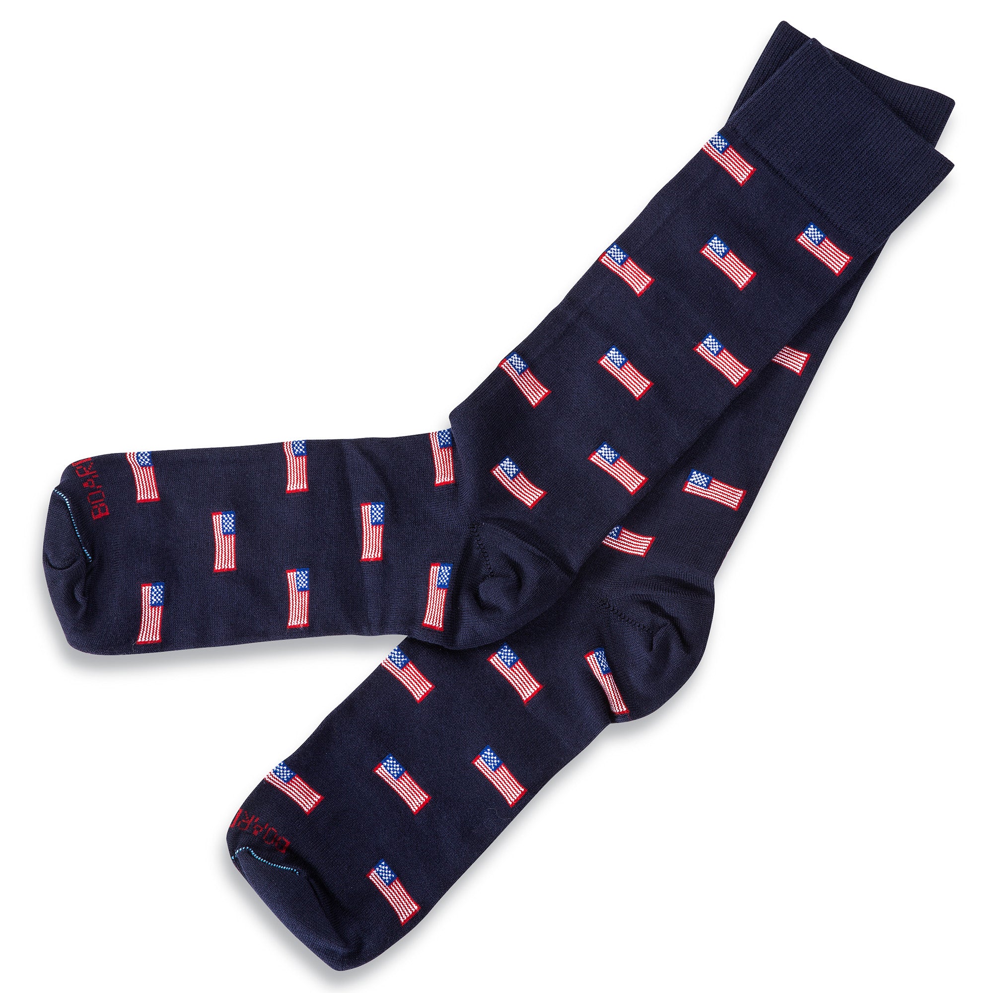 navy American flag cotton mid-calf dress socks atop white table