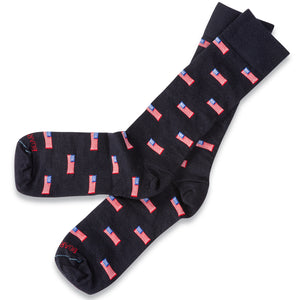 American flag navy merino wool dress socks atop white tabletop