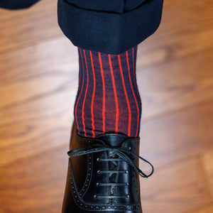 navy and red shadow stripe wool dress socks worn with black oxfords and navy slacks