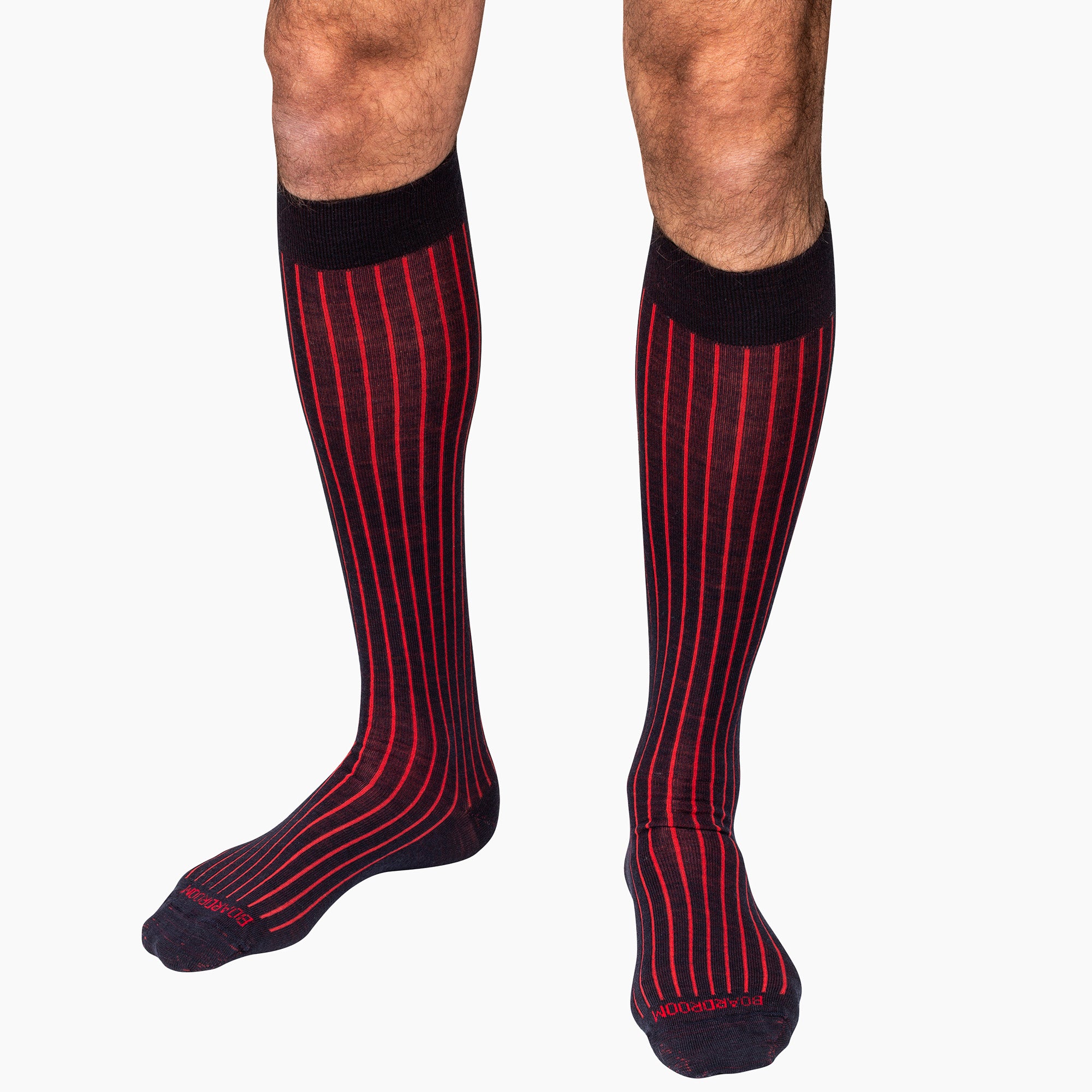 navy and red shadow stripe over the calf dress socks worn by model