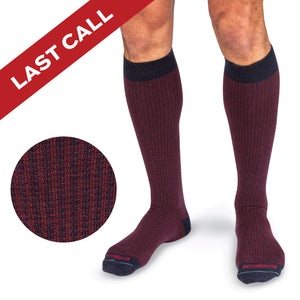 model wearing navy and burgundy houndstooth socks with last call banner overlay