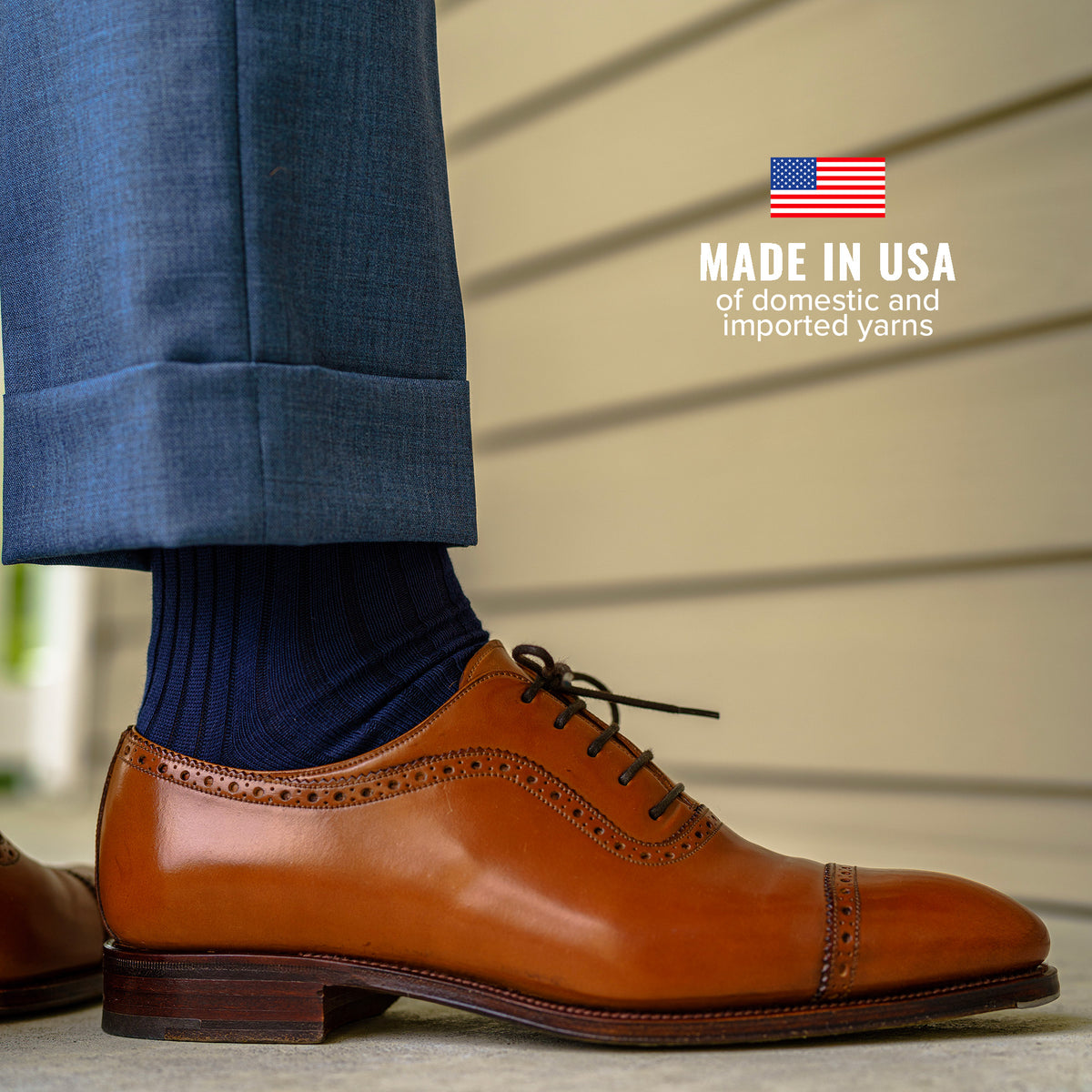 navy cotton dress socks with blue slacks and light brown oxfords