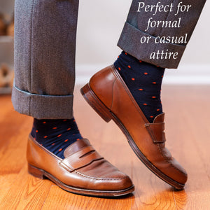 navy wool dress socks with orange polka dots and grey slacks with light brown penny loafers