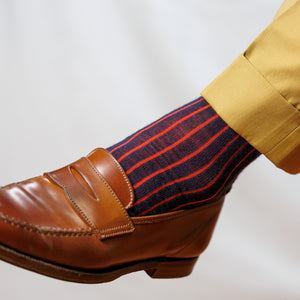 navy and red shadow stripe dress socks with tan slacks and brown penny loafers