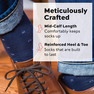 man wearing navy geometric pattern cotton dress socks with jeans and brown shoes